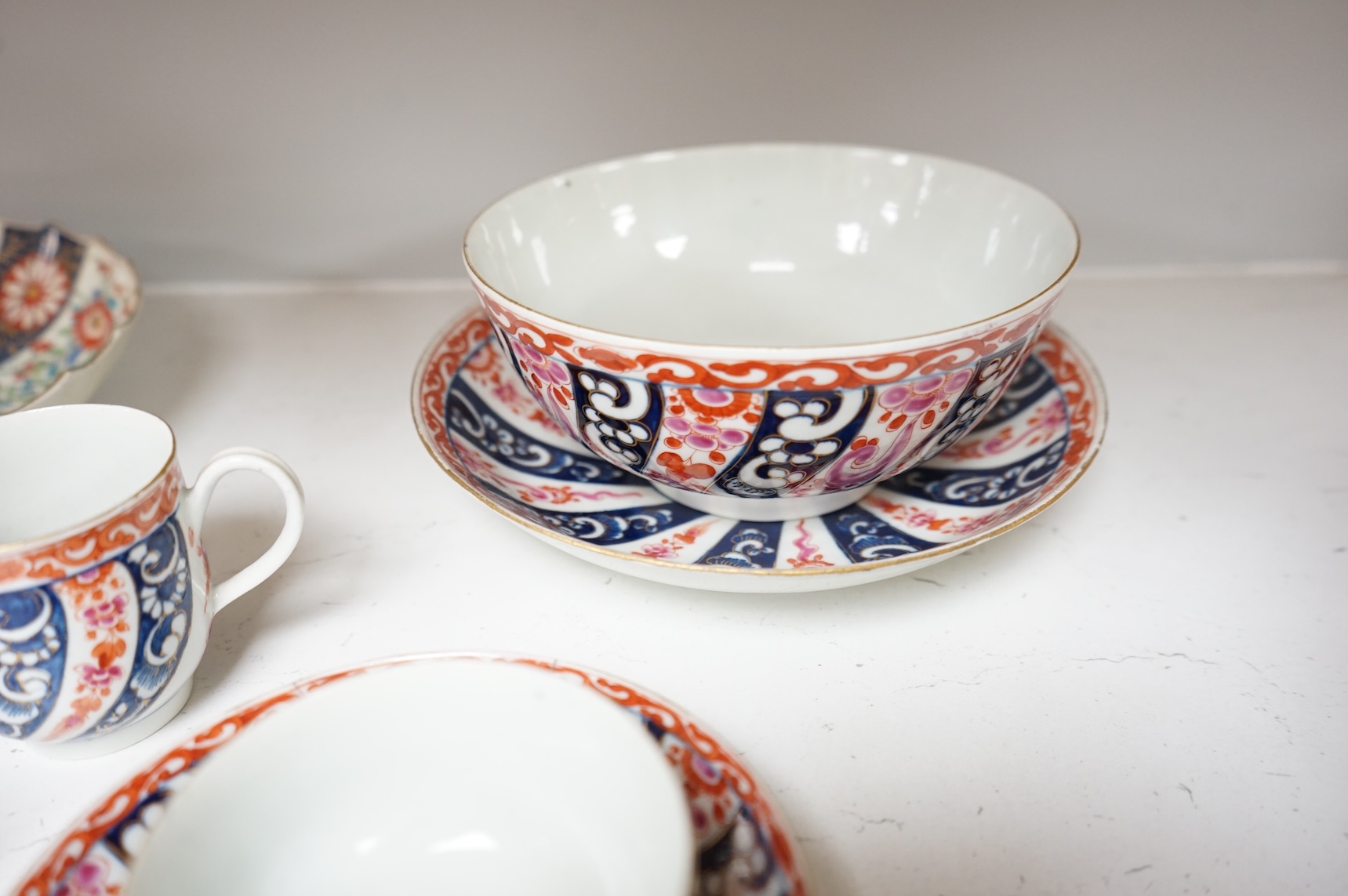 A Worcester Lord Henry Thynne type fluted tea bowl and saucer, c.1780, a group of Worcester Queen Charlotte pattern tea and coffee wares, c.1790-1810, two Worcester Kakiemon style dishes, largest 21cm in diameter